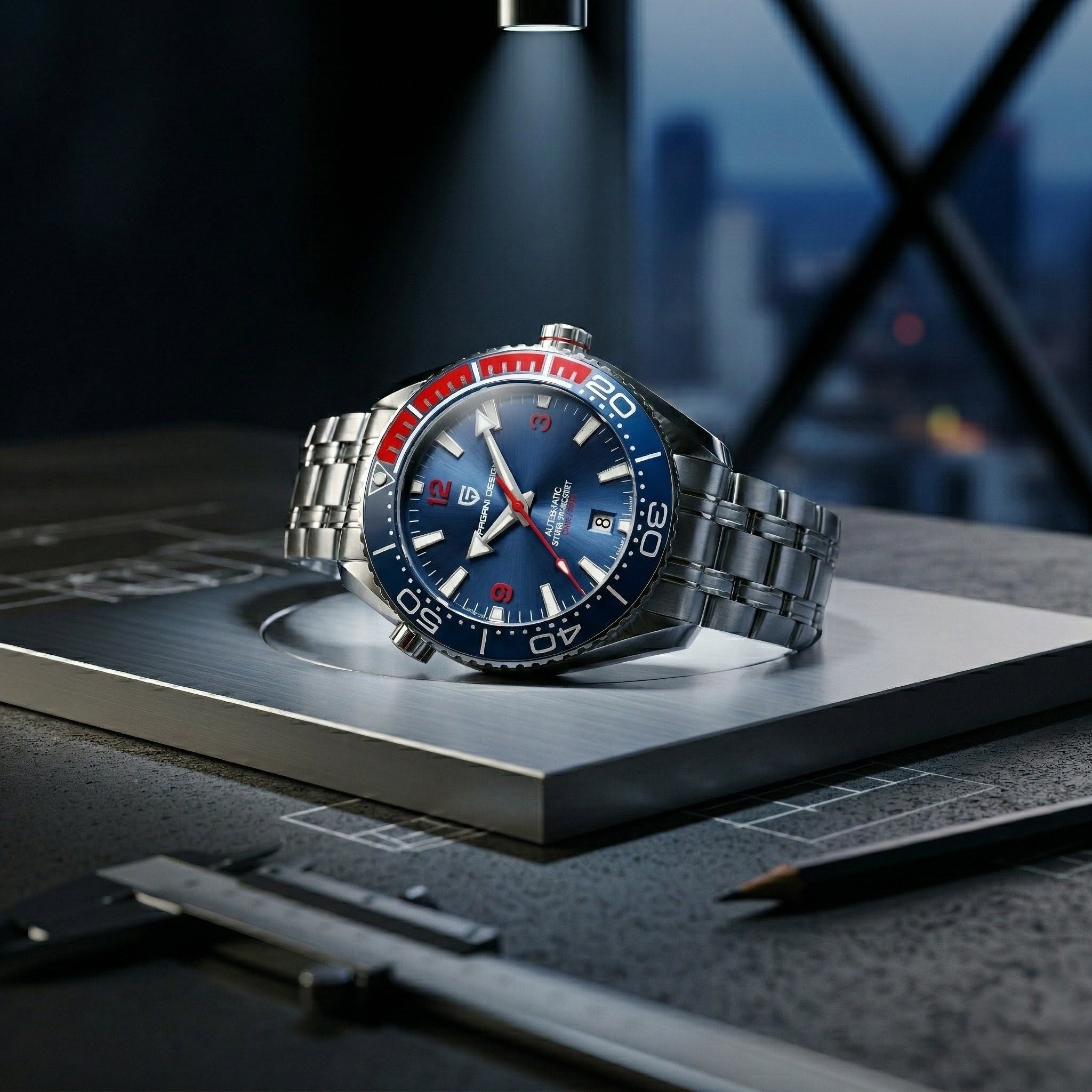 Luxury watch with blue dial and silver metal strap on a dark surface with blurred cityscape background