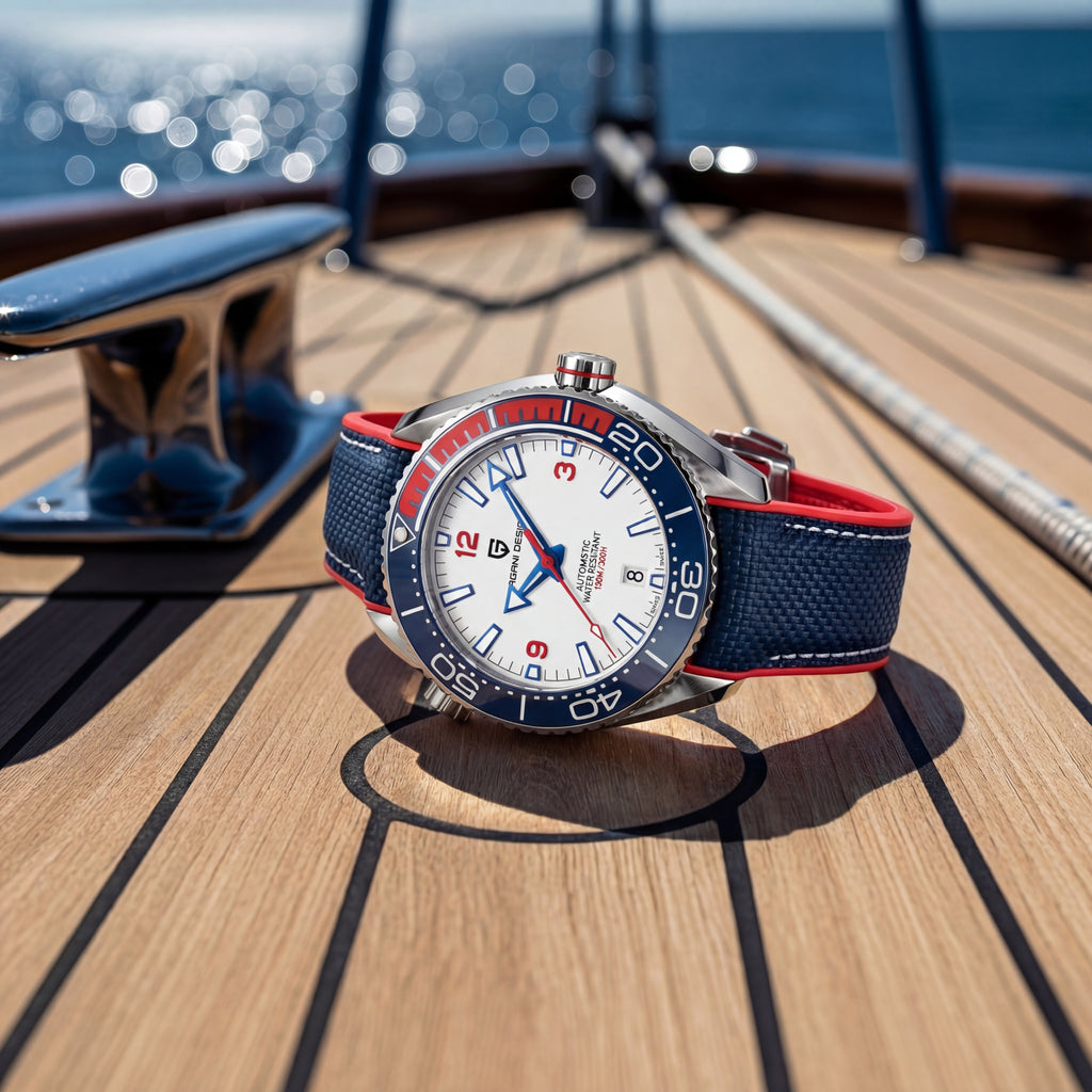Watch with a blue and red strap on a wooden deck with ocean view