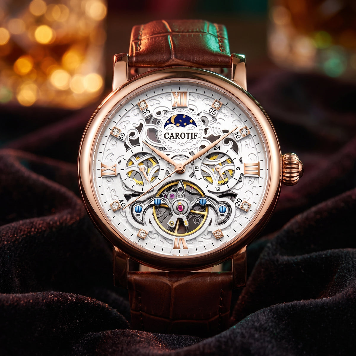 A luxury Carotif skeleton watch with a rose gold case, white dial, and brown leather strap, displayed on a dark velvet fabric with warm bokeh lights in the background.